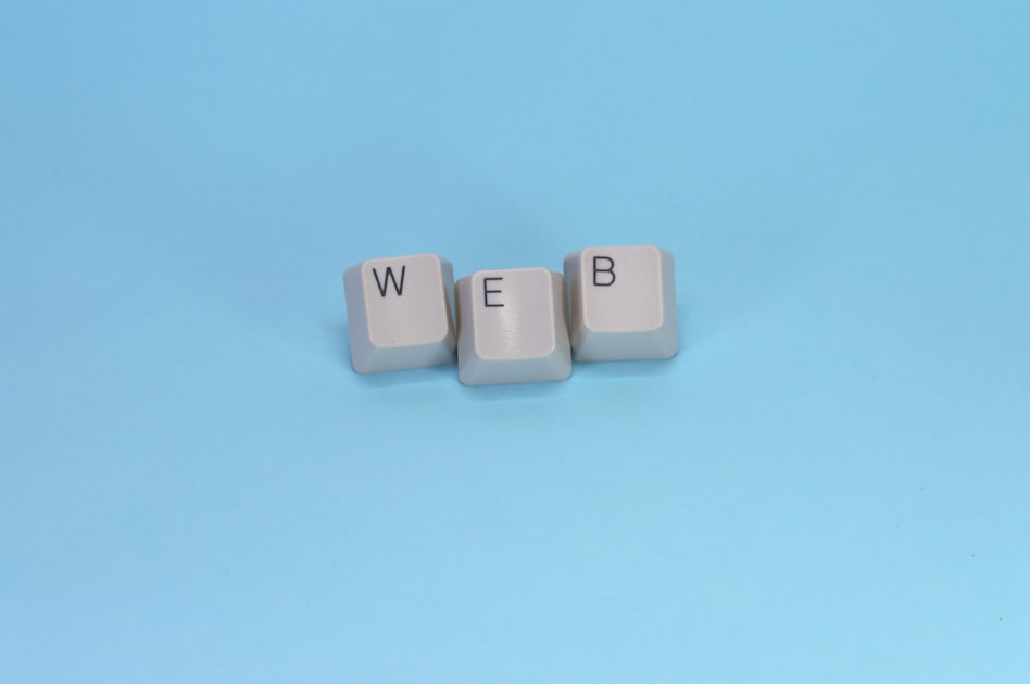 Keyboard keys spell out the word "web."